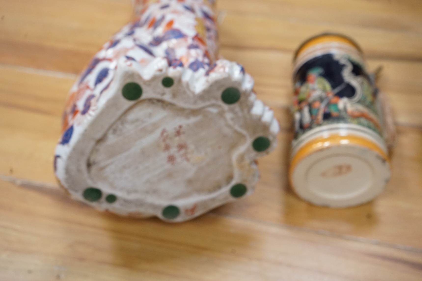 A collection of German ale steins and an Imari seated cat-37cm high